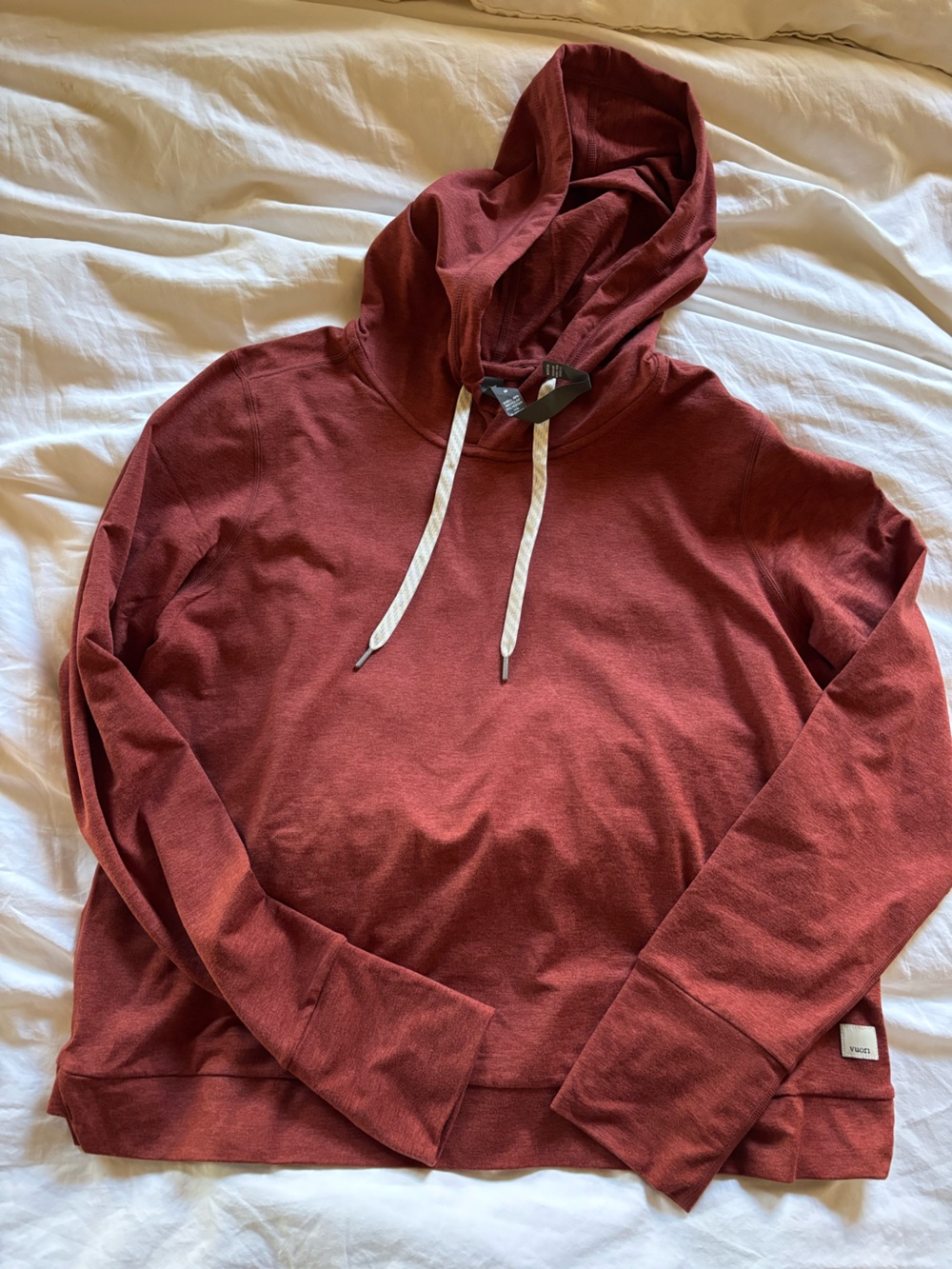 Vuori women’s light weight hoodie in rust